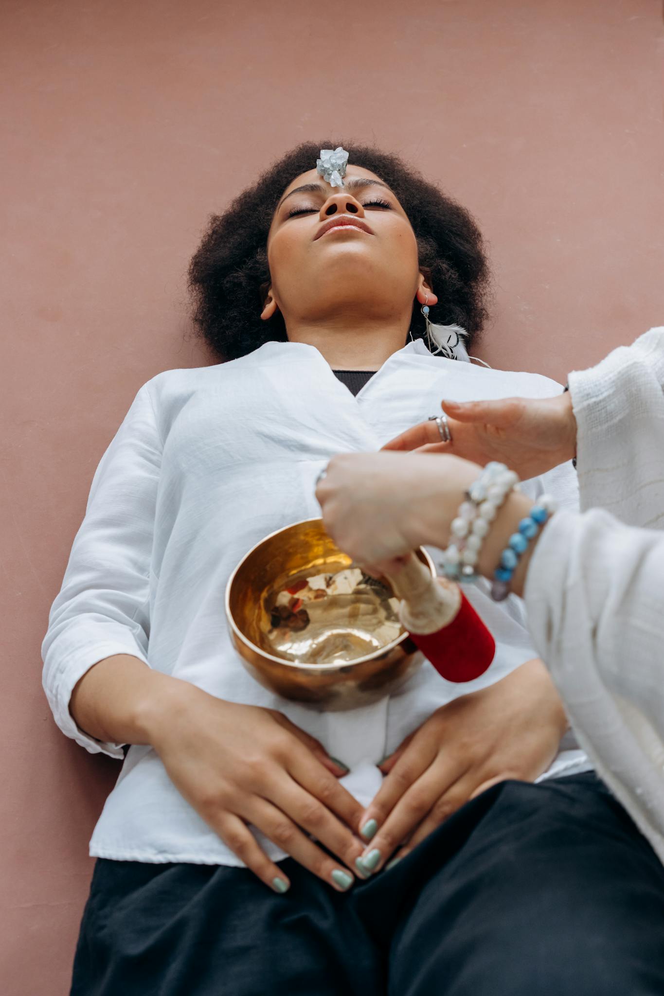 Woman in White Long Sleeve Shirt Holding White Ceramic Bowl With Food